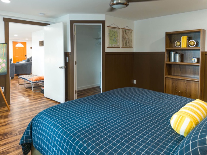 Another view of the king bedroom and its wood floors