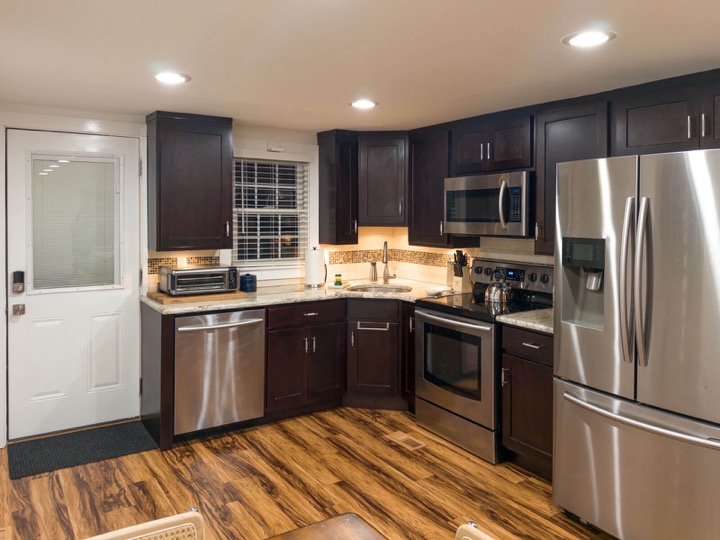 Kitchen counters and dark wood cabinets at The Rambler’s Rest
